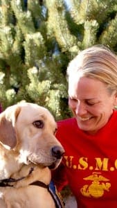 Krause-Parello with Waffle, a facility dog at the Denver Veterans Affairs Medical Center. Waffle was trained by Canine Companions for Independence.