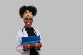 Student nurse holding textbooks