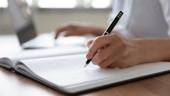 Nurse writing journal article