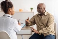 nurse listening to patient